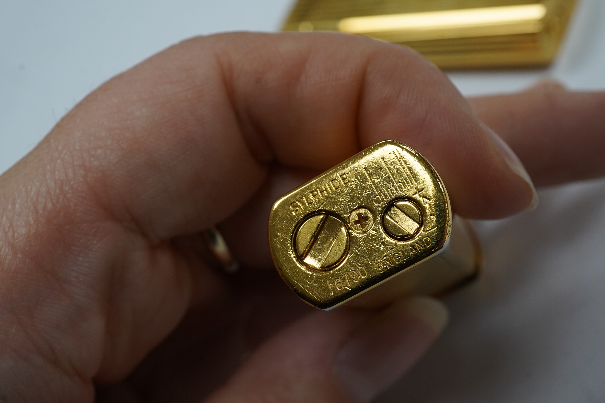 A Dunhill Sylphida lighter and Cartier lighter, numbered 88821. Condition - fair